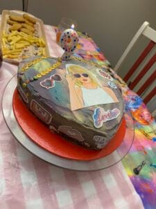 colourful taylor swift birthday cake with 9 candle